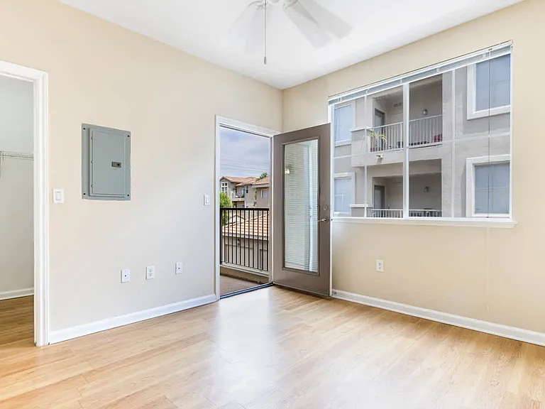 Bedroom with Balcony and Hard Surface Flooring