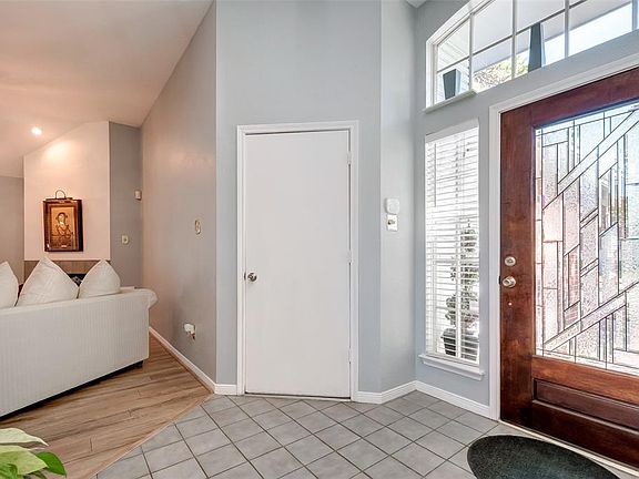 Beautiful entry with tons of natural light- entry leads into the formal living and dining room