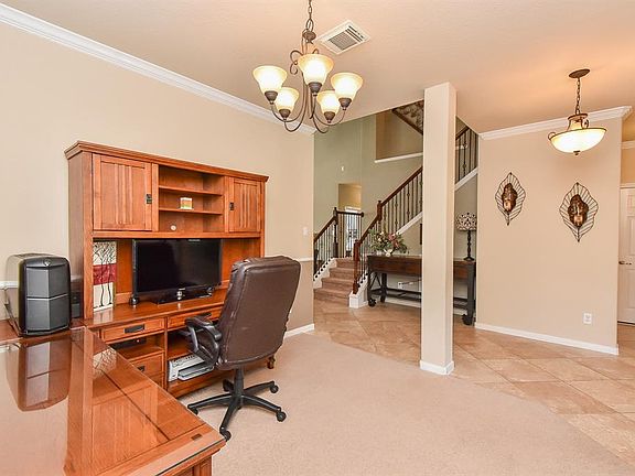Column accent in dining room. Pretty light fixtures.