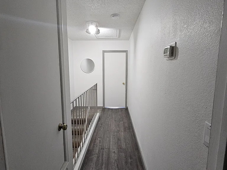 Upstairs hallway looking toward south bedroom.