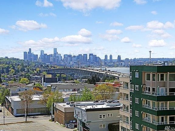 Condo building with downtown in background