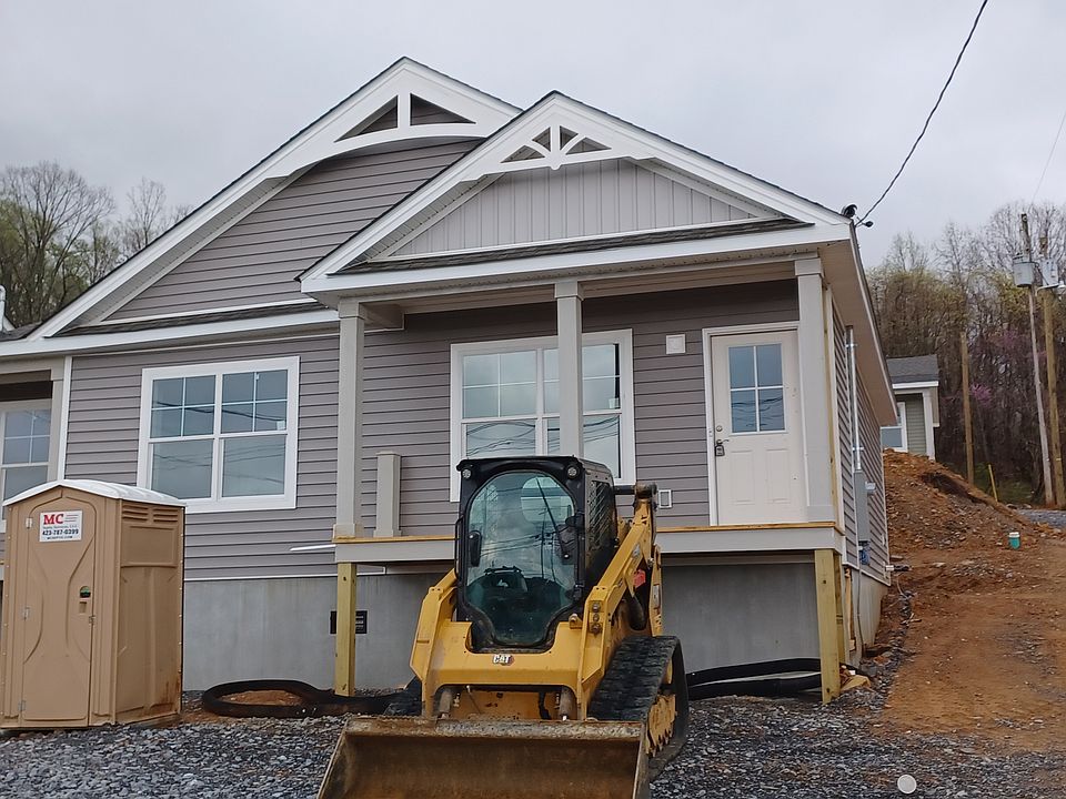 Unit 1 is the one on the right. This photo was taken before the front porches were finished and the parking area was paved.