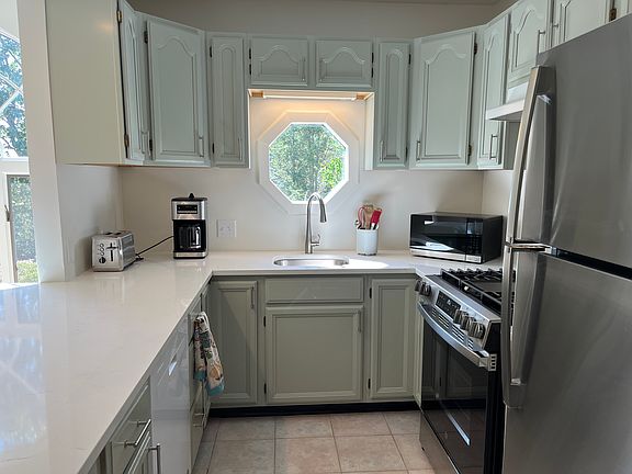 Newly updated kitchen including quartz countertop and new appliances.