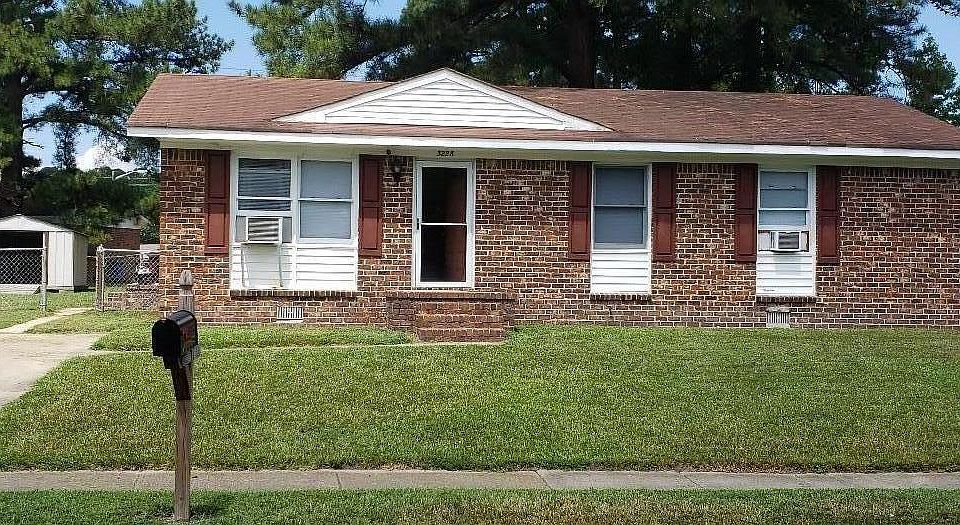Exterior Front. Note fenced yard with large shed (has new floor)