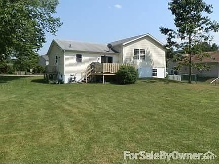 House from backyard
						:
						View is from the backyard (in front of shed) looking toward the street.
