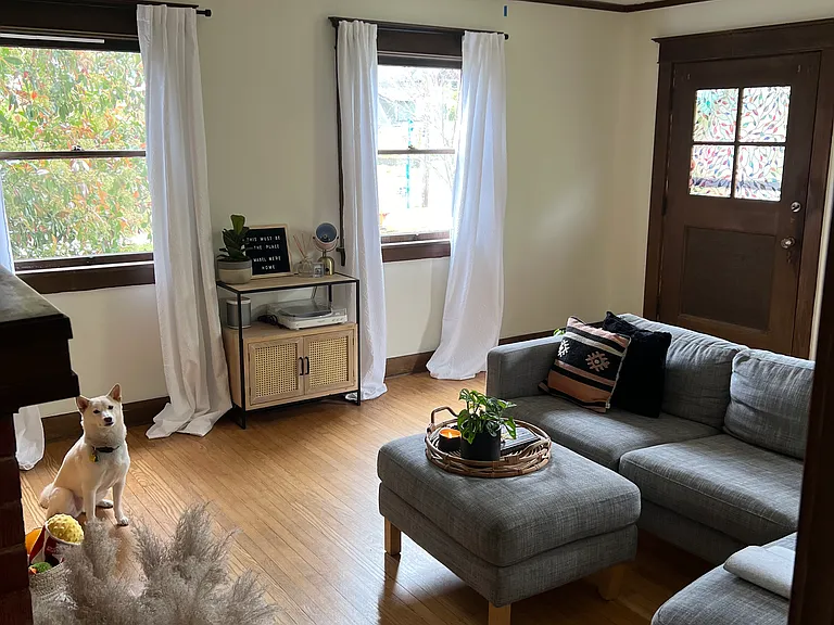 A viewpoint of the living room and entryway from the bedrooms.
