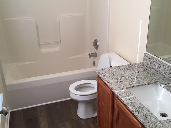 master bath with granite vanity top