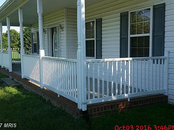 Lovely front porch overlooking spacious front yard