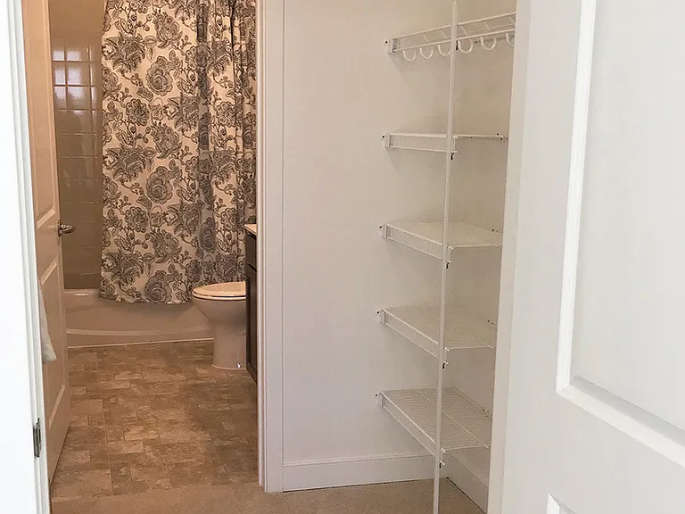 Large walk-in closet with bathroom access
