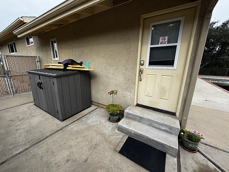 Front door to unit with keyless entry. Ground level unit (2 steps into front door). Exterior storage shed for your personal use to store your sporting equipment, etc. Also small BBQ available for your personal use.