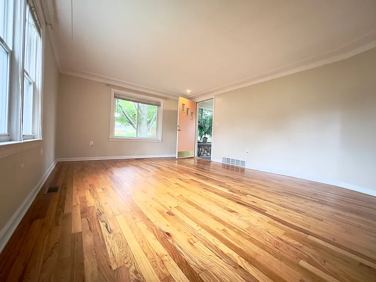 Large living room with hardwood flooring
