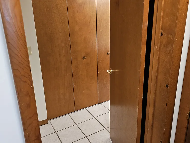 Door to bathroom and laundry center