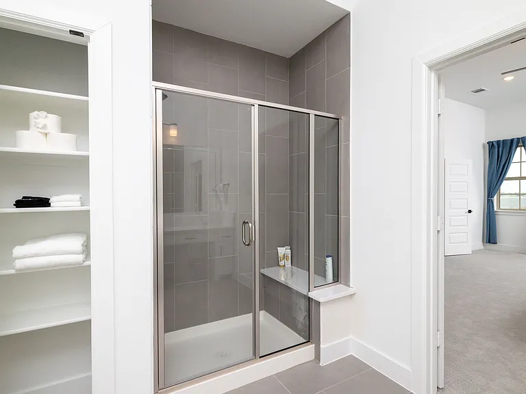 Primary bathroom has a garden tub, two sinks, and a walk-in shower