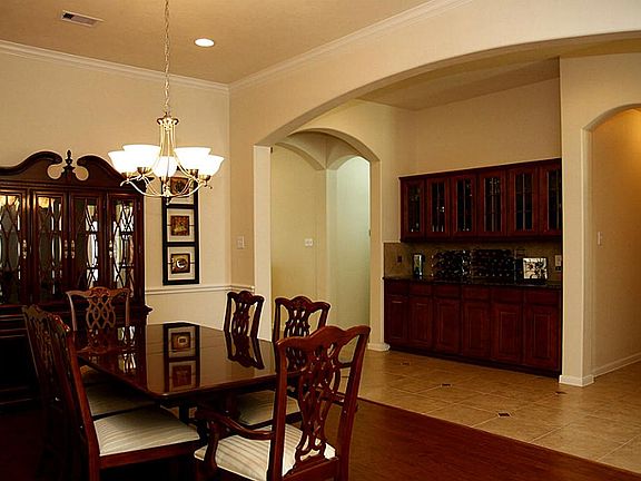 Look at this impressive Butler's Pantry with Granite Countertops & ton's of storage. Notice the tile