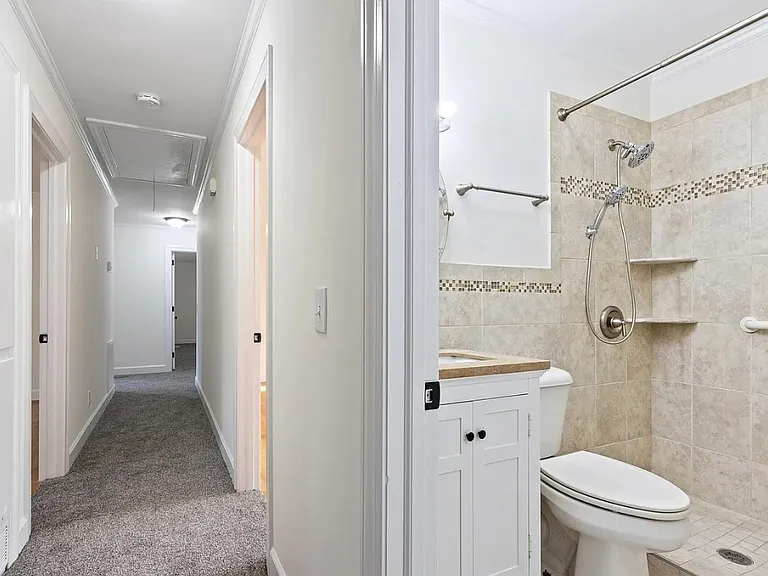 View of hallway connecting all bedrooms