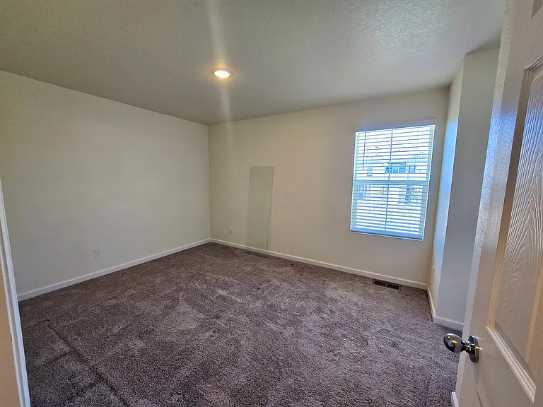 Second Bedroom is big enough to fit a dresser and king size bed comfortably.