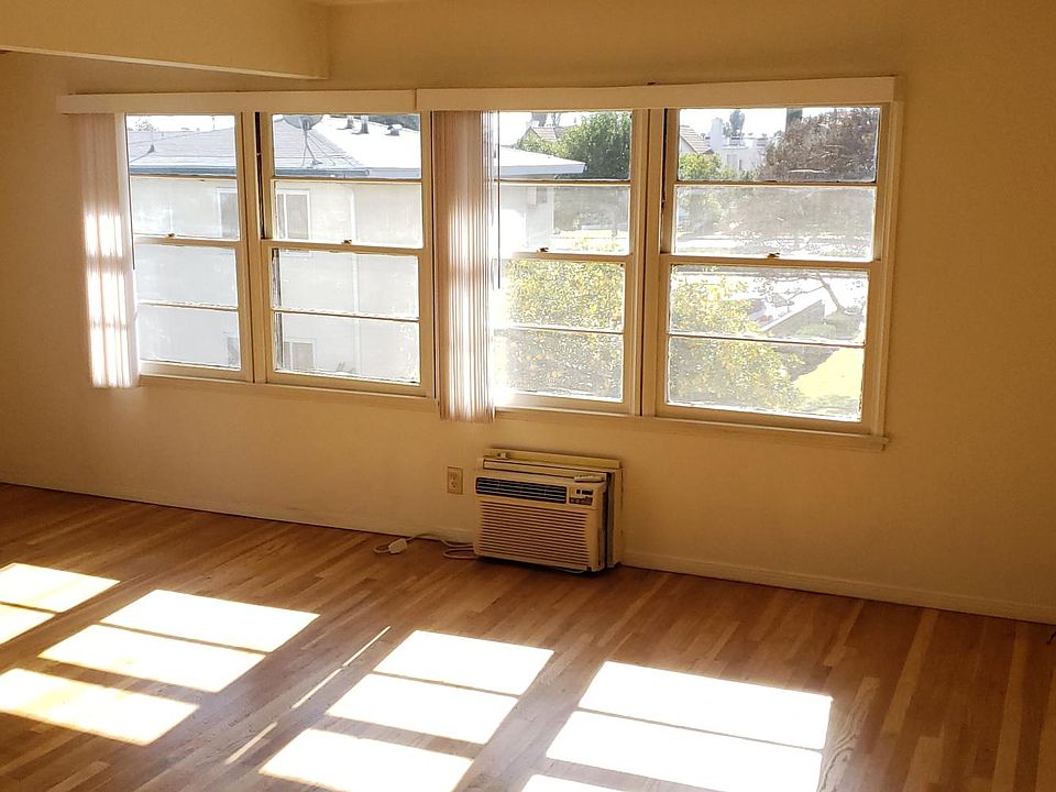 Spacious bright living room with wall mount AC unit
