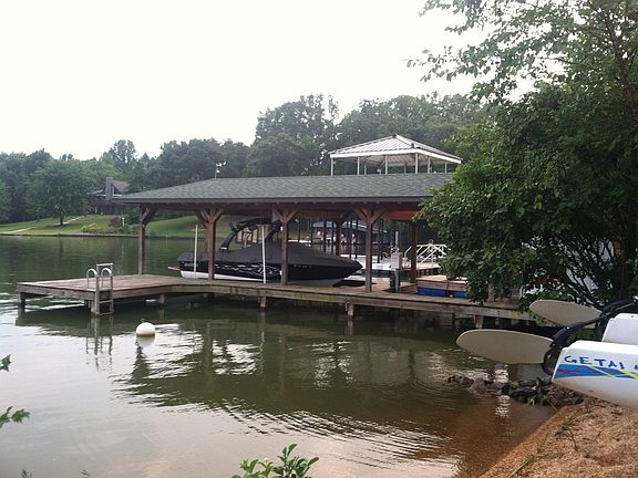 Boat house with boat lift, 2 jetski lifts and 8*10 shed. "beach". 5' depth