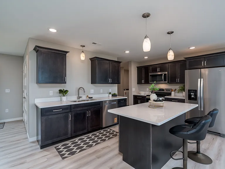 Spacious Kitchen, New Stainless Whirlpool appliances, Quartz tops, soft close drawers, walk in pantry.