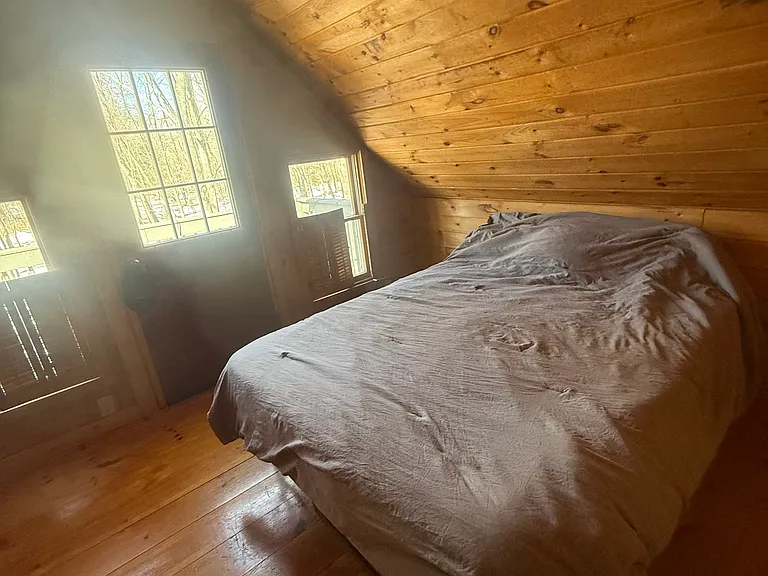 Main bedroom with access to private 2nd-floor balcony