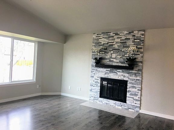 Great room and vaulted ceiling and ceiling fan