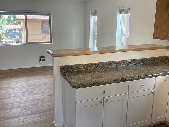 Breakfast bar between kitchen and living/dining area.