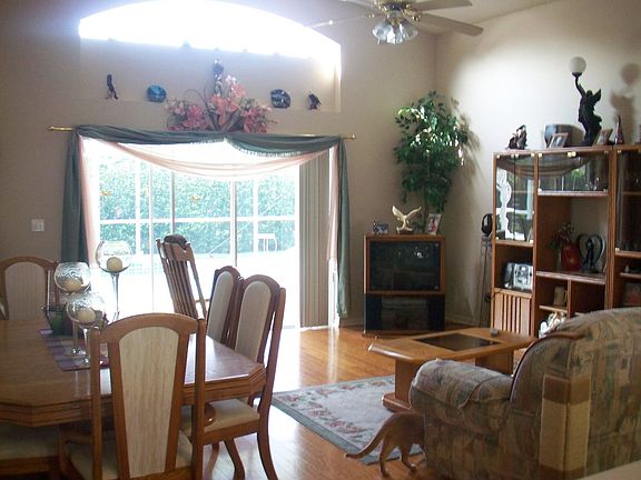 Greatroom w/ transom window overlooks POOL