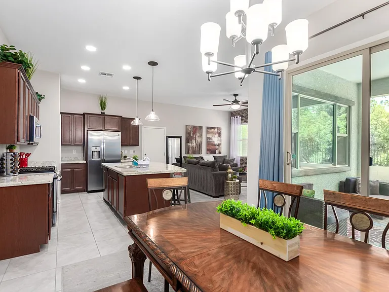 Dining room views to the backyard evergreen trees park.