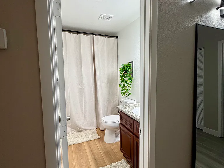 Conveniently located bathroom serving the living area and guest bedrooms