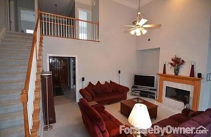 Great Room : Large TV alcove. 20 foot ceilings, with balcony and gas / wood fireplace.