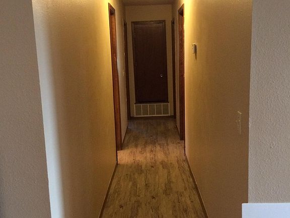 Hallway to the full bath and dressing room on the left. Next to that on the same side as the master bedroom with an en suite bathroom and separate dressing area. On the right hand side as you_re looking at the picture there are two bedrooms that_s a good