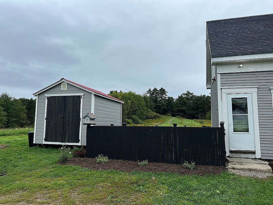 Storage shed and fenced area