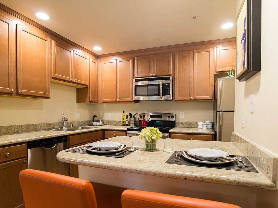 Stainless steel appliances, lots of counter space and cabinet storage, and a small breakfast bar