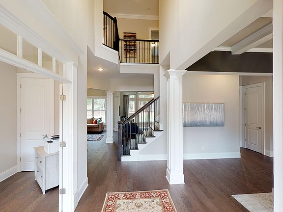 Grand entry with soaring ceiling and generous molding New Construction. Representation of Home.