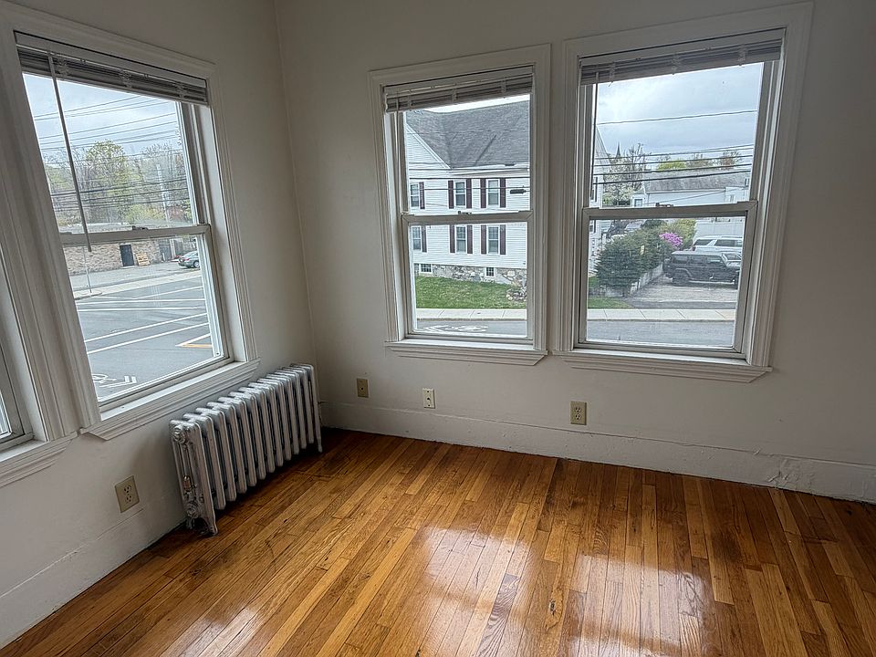 Small office or sunroom ~ beautifuly hw flooring with windows offering lots of light!