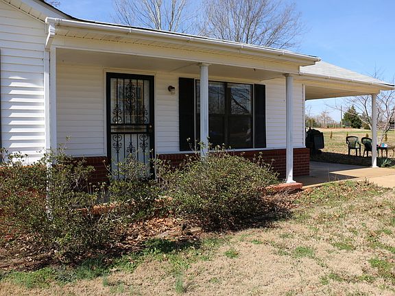 Covered front porch and carport