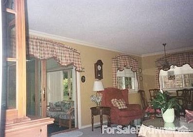 Livingroom and diningroom with doorwall to sunroom.