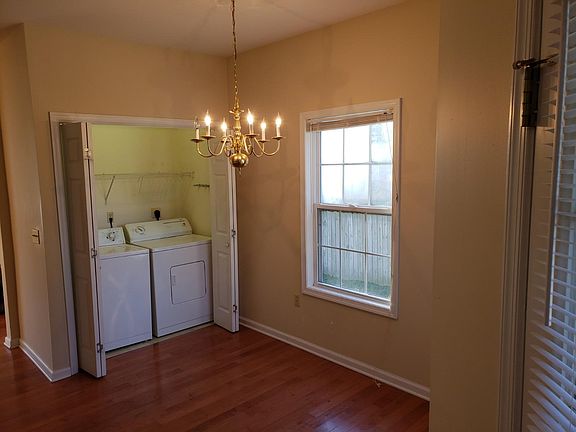 Dining area: door on right leads to covered porch Laundry area with full-size washer and dryer.