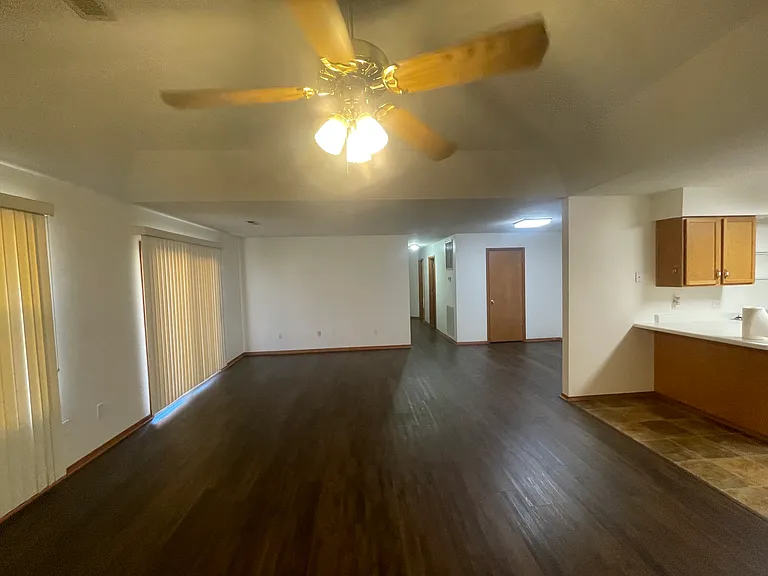 Large open plan, allowing for different combinations of living, dining, office, and game rooms, with an outdoor area through the sliding glass doors.