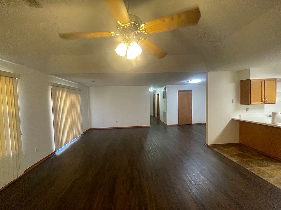 Large open plan, allowing for different combinations of living, dining, office, and game rooms, with an outdoor area through the sliding glass doors.