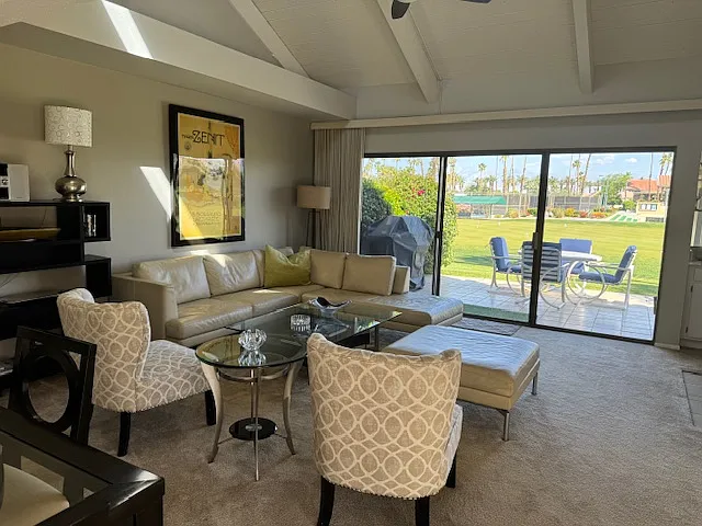 Living room looking out to back patio and view.