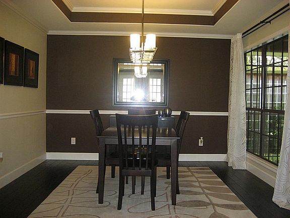 Formal dining room with nice view of slate tiled patio