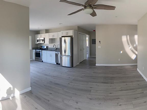 Panoramic shot from corner of LR. Entry door is where light is shining in from, top right.