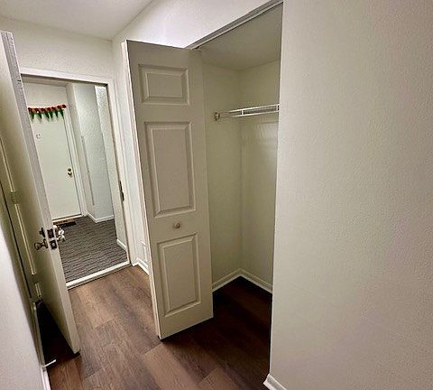 Front door of unit and entry coat closet