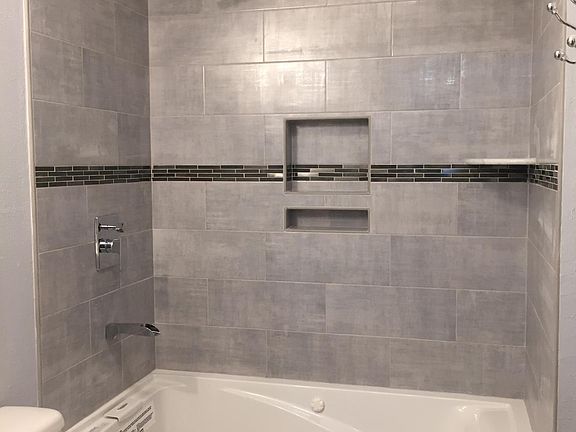 New tub and tiled shower wall