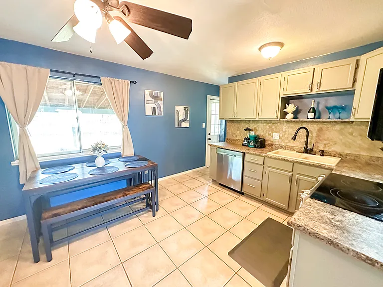 Cook Up a Storm! ____ _ Discover your inner chef in our well-stocked kitchen, featuring utensils and kitchenware. Enjoy meals with family or friends at the spacious 6-seater dining table.