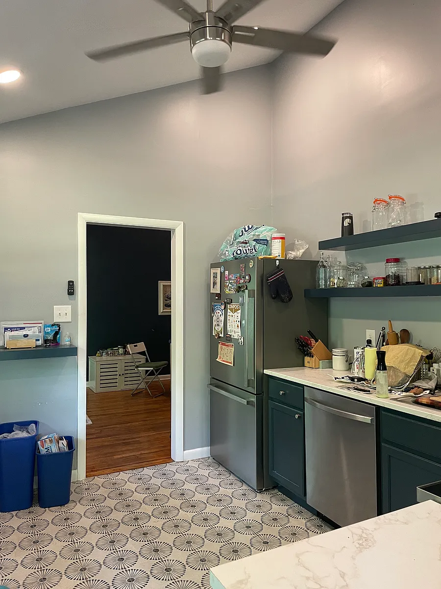 Modern kitchen with stainless steel appliances, tile floors, and high ceilings - 380 Sanders Ct