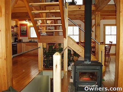 Woodstove & Stairs to Upper/Lower Levels
