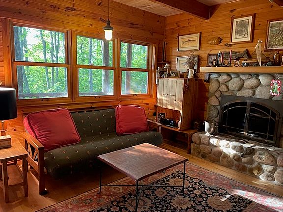 Living room area. Windows look out onto deck