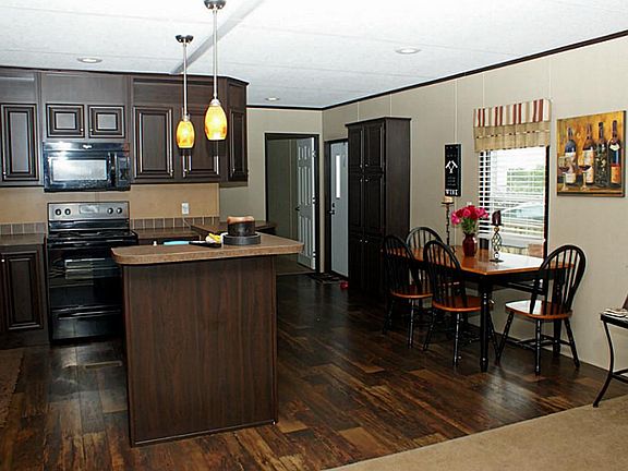 An island kitchen with a charming dining/breakfast room. Notice the beautiful vinyl flooring!